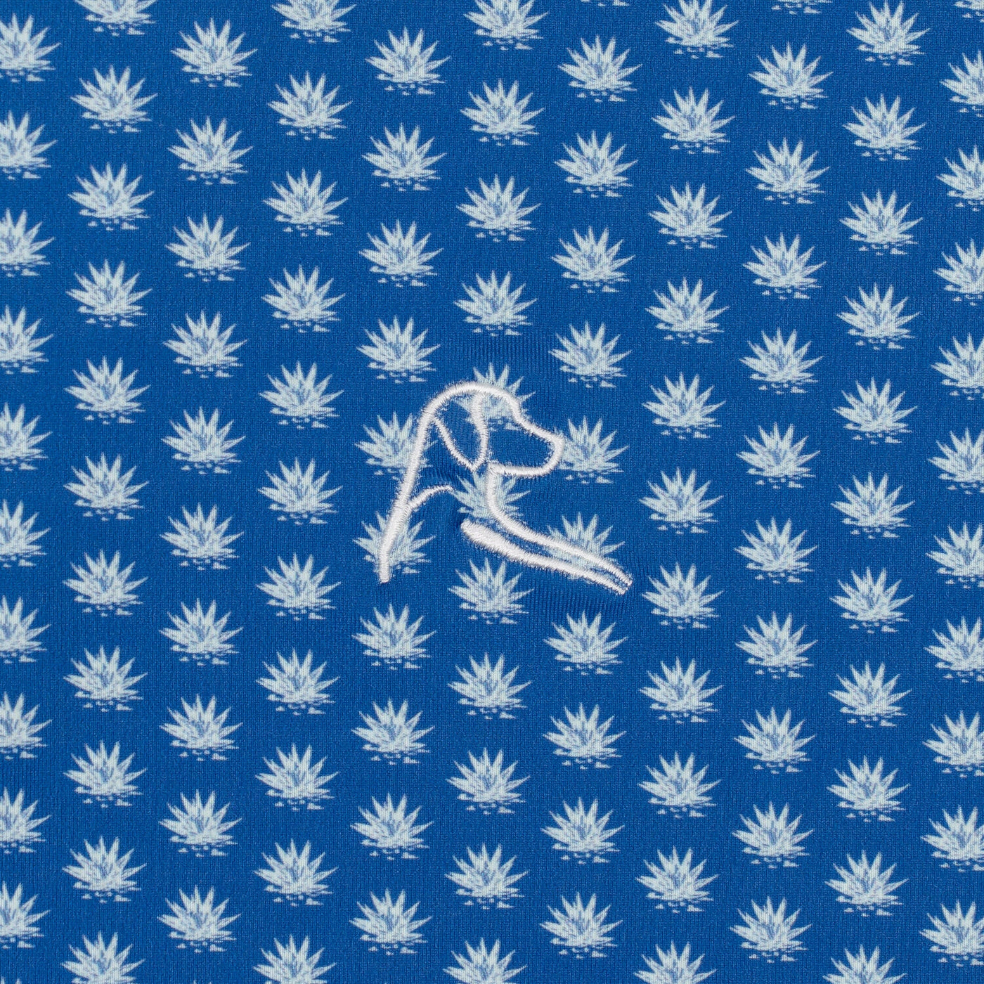 RHOBACK’s The Agave 2.0 Performance Polo in Short Stop Blue/Seafoam features a repeating white leaf pattern, an embroidered dog head, and UPF sun-protection with moisture-wicking fabric for comfort and style.