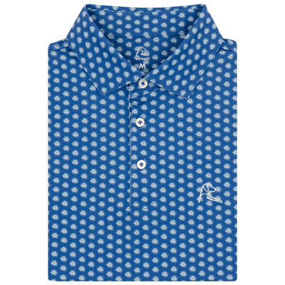 The RHOBACK Agave 2.0 Performance Polo in Short Stop Blue/Seafoam features a collared design, repeating white palm tree pattern, three white buttons, moisture-wicking fabric, and an embroidered white logo on the lower right side.
