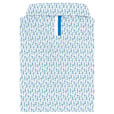 The Blue Bonnet 2.0 Performance Polo by RHOBACK in White/Lake Blue features a blue and green leafy pattern, moisture-wicking fabric for all-day comfort, and a blue strip inside the placket, shown front-facing with the collar up.