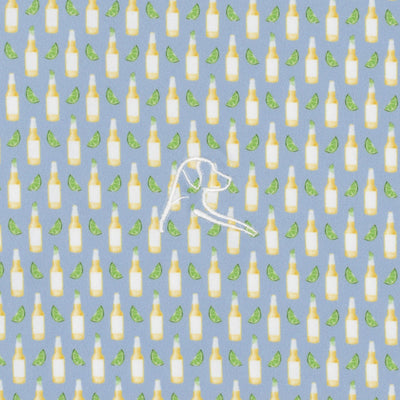 The RHOBACK The Cerveza Performance Polo features a pattern of yellow beer bottles and green lime wedges on oxford blue, with a white stitched dog head outline. Made from moisture-wicking fabric to keep you cool and comfortable all day.