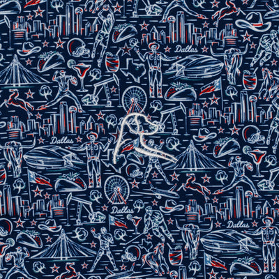 The DFW Performance Polo by RHOBACK features white and red Dallas landmarks, cowboys, rodeo scenes, boots, hats, stars, tacos, and Ferris wheels on a navy background with UPF protection—perfect for showing Texas pride.