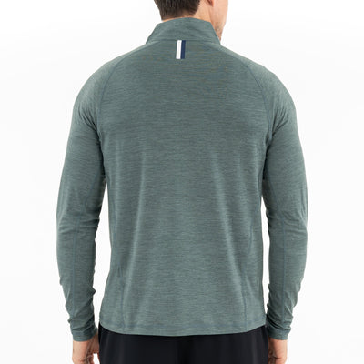 A man is shown from the back wearing the RHOBACK Tailwind Performance Q-Zip in Heather - Jungle Green/Dusty Pine, a long-sleeved, moisture-wicking SkyKnit™ jacket featuring a small vertical striped detail near the collar.