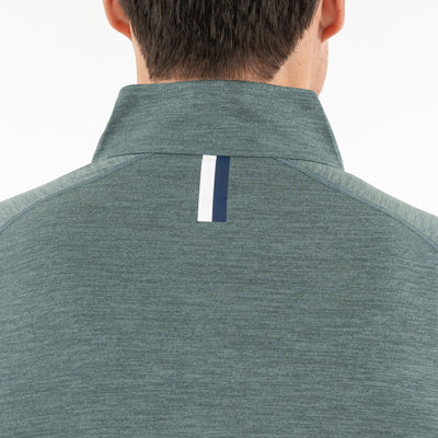 A person with a short dark haircut is seen from behind, wearing the RHOBACK Tailwind Performance Q-Zip in Heather - Jungle Green/Dusty Pine, featuring a high collar and a vertical white and navy stripe below the collar.