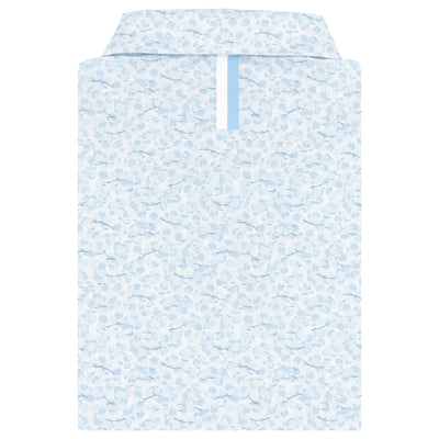 The Iridescence Performance Polo by RHOBACK in White/Pure Blue features a subtle floral pattern and breathable fabric, neatly displayed from above against a white background.