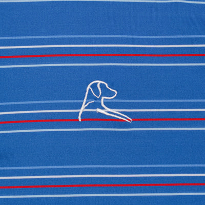 The RHOBACK Ivy Stripe Performance Polo in Short Stop Blue/White features horizontal white and red stripes, a central embroidered dog’s head and front legs in white, and moisture-wicking comfort for all-day wear.