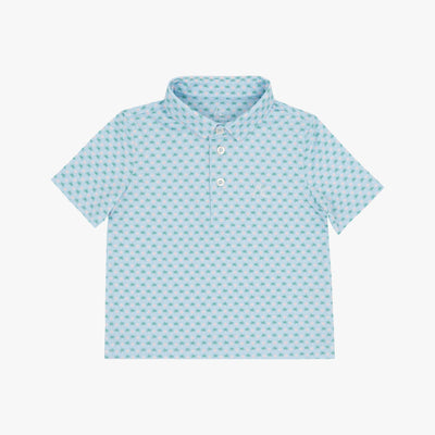 The Lil' Spring Ball Performance Polo by RHOBACK in pale blue features a small geometric pattern, three white buttons, and sun protection, shown on a plain white background.