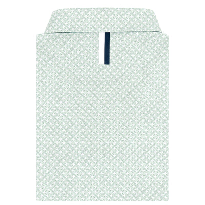 The RHOBACK Lime Performance Polo in White/Spanish Moss features a subtle light green geometric pattern and navy accent on the placket. Made from moisture-wicking fabric, it’s displayed against a white background.