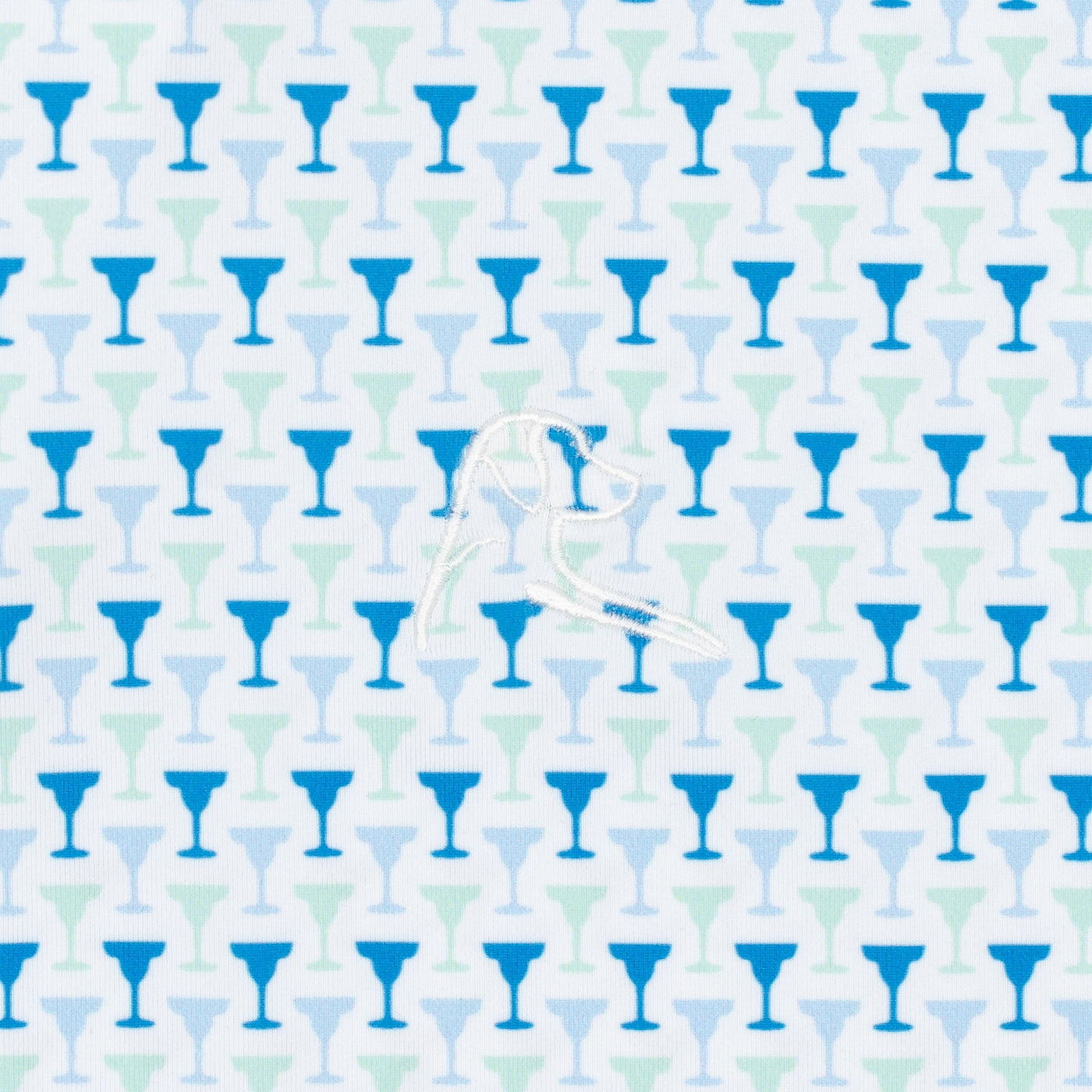 The Marg Performance Polo by RHOBACK in White/Birdie Blue features small blue and teal cocktail glasses on white, with a white embroidered bird—offering moisture-wicking comfort for sunny days.