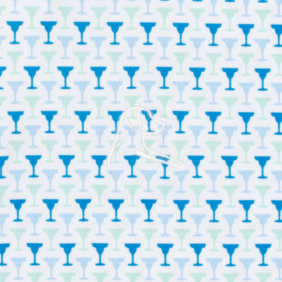 The Marg Performance Polo by RHOBACK in White/Birdie Blue features small blue and teal cocktail glasses on white, with a white embroidered bird—offering moisture-wicking comfort for sunny days.