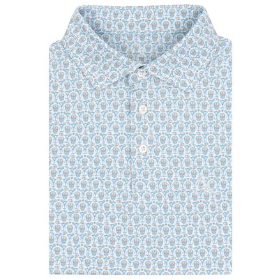 The Sugar Skull Performance Polo by RHOBACK features a classic collar with three white buttons, short sleeves, and moisture-wicking fabric in a white/maritime blue circular pattern.
