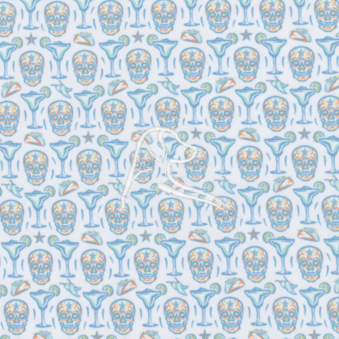 The Sugar Skull Performance Polo by RHOBACK features blue and orange skulls, martini glasses, lime wedges, and starfish on a white background with a central white embroidered logo. Offers sun protection and moisture-wicking comfort all day.